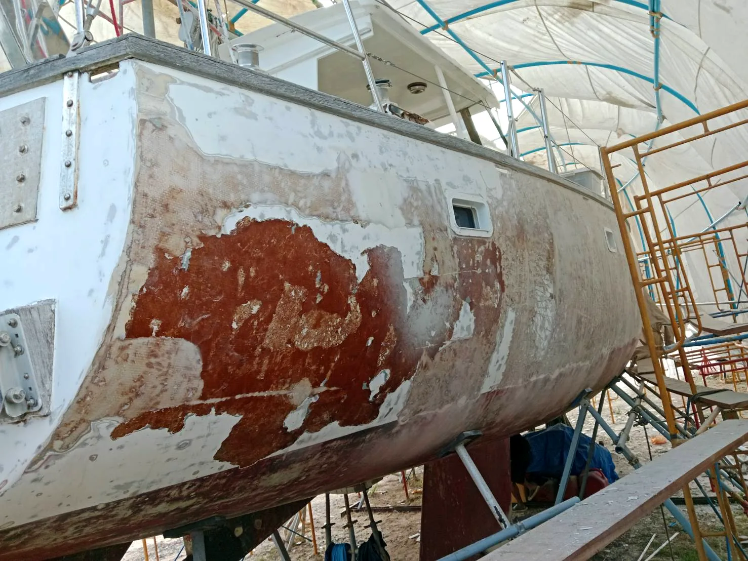 Hull with primer applied, old paint partially removed