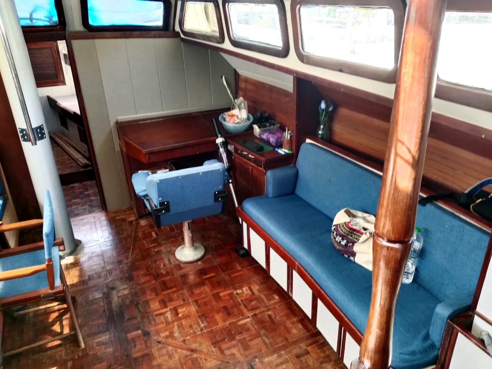 Salon with restored sofa and parquet flooring