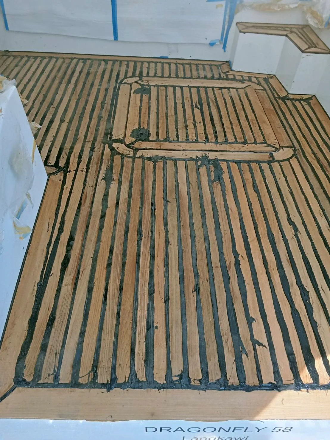 New teak deck panels with fresh caulking