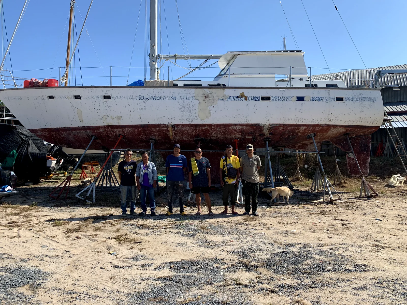 South Sea Marine refit team standing in front of Dragonfly 58